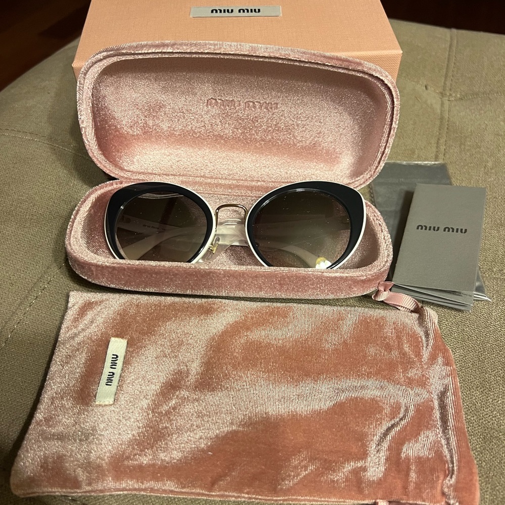 New Miu Miu Cat Eye Sunglasses. Retail for $379.99. Never been worn.